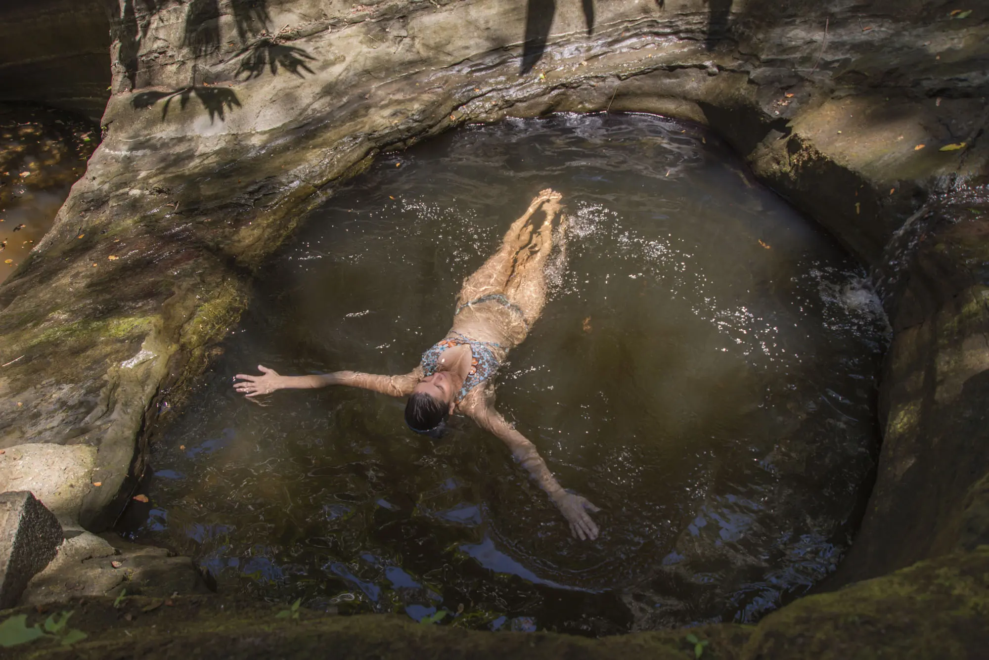 floating in a natural pool