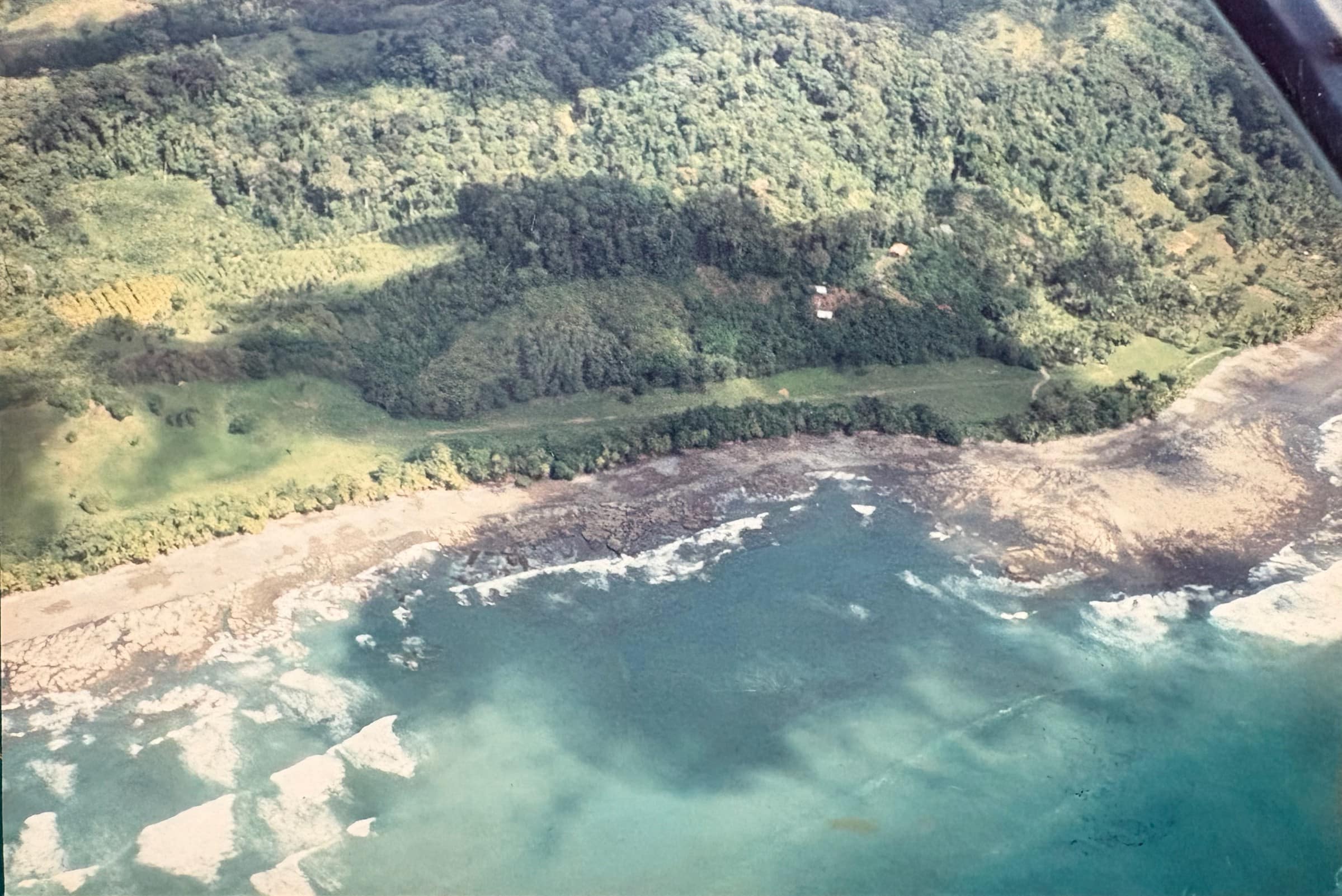 Aerial view of Tiskita in the early 1990s, showing the fruit orchard, cabins and Pacific coastline