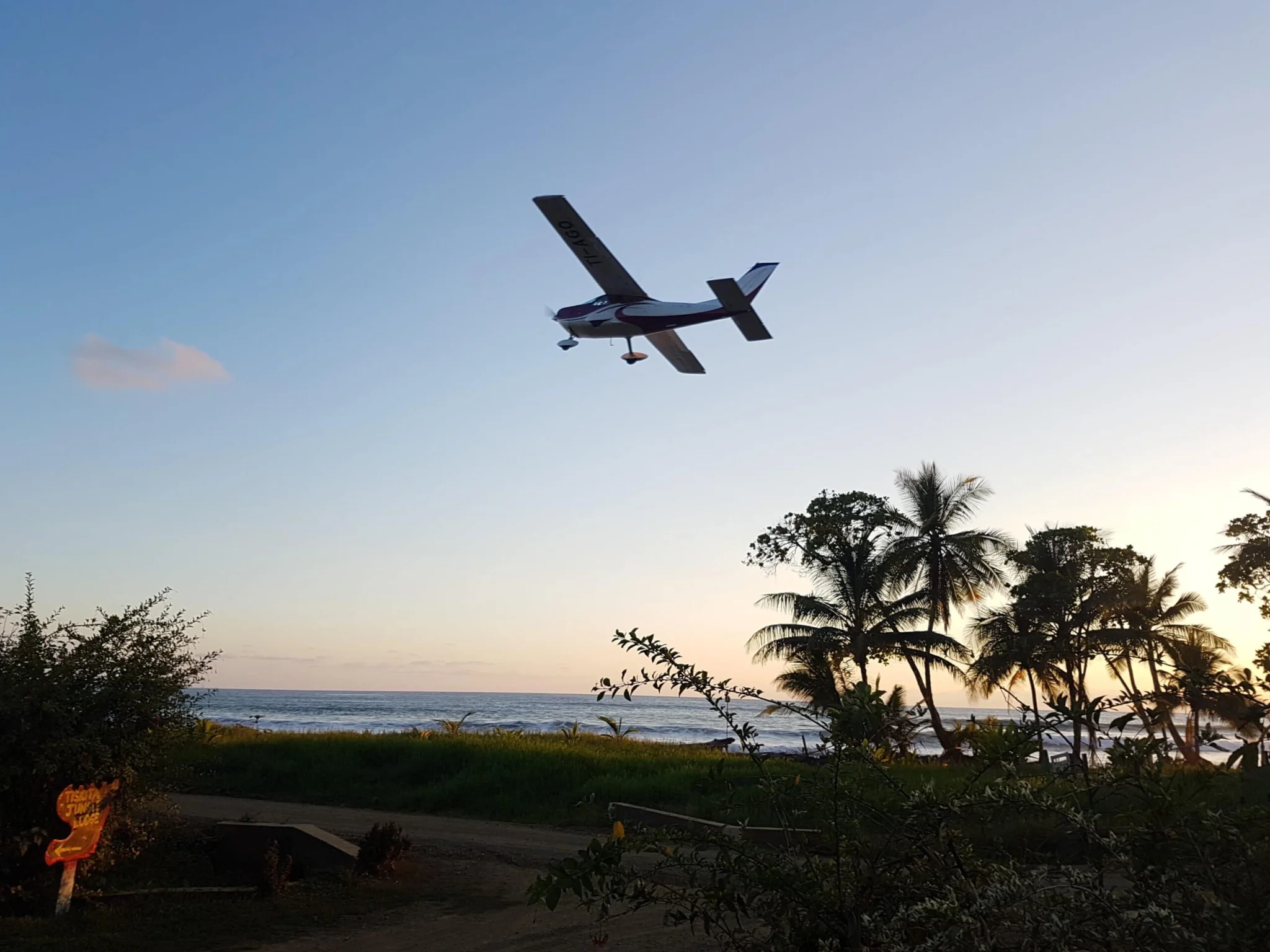 private charter airplane landing at Tiskita
